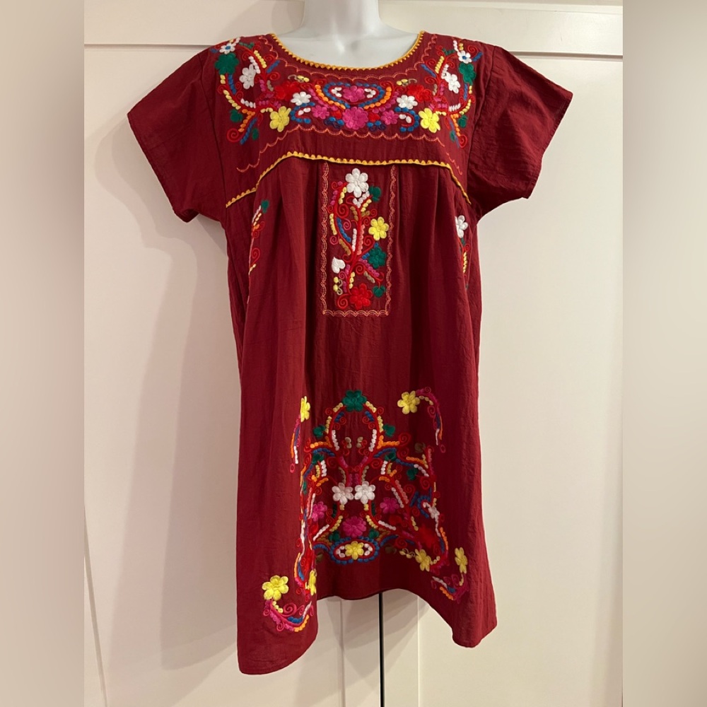 Gorgeous fiesta dress with vibrant embroidery.